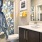 a bathroom with a shower and cabinets and a sink
